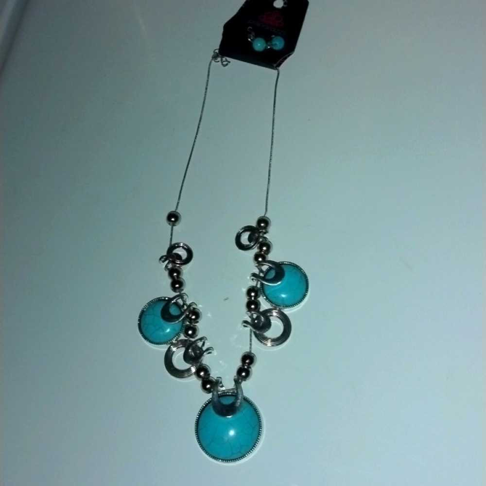 Necklace and earnings turquoise, and silver.